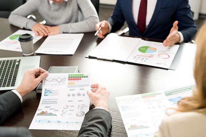 Enhancing Revenue through Data Analytics 1 Meeting where people analysing data