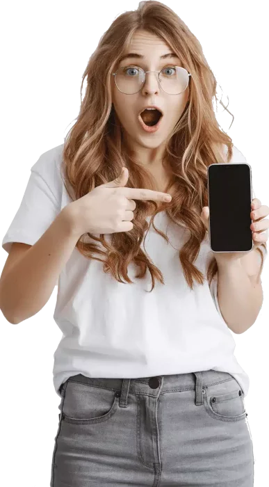 Image of an excited girl pointing her finger towards mobile holding on her left hand